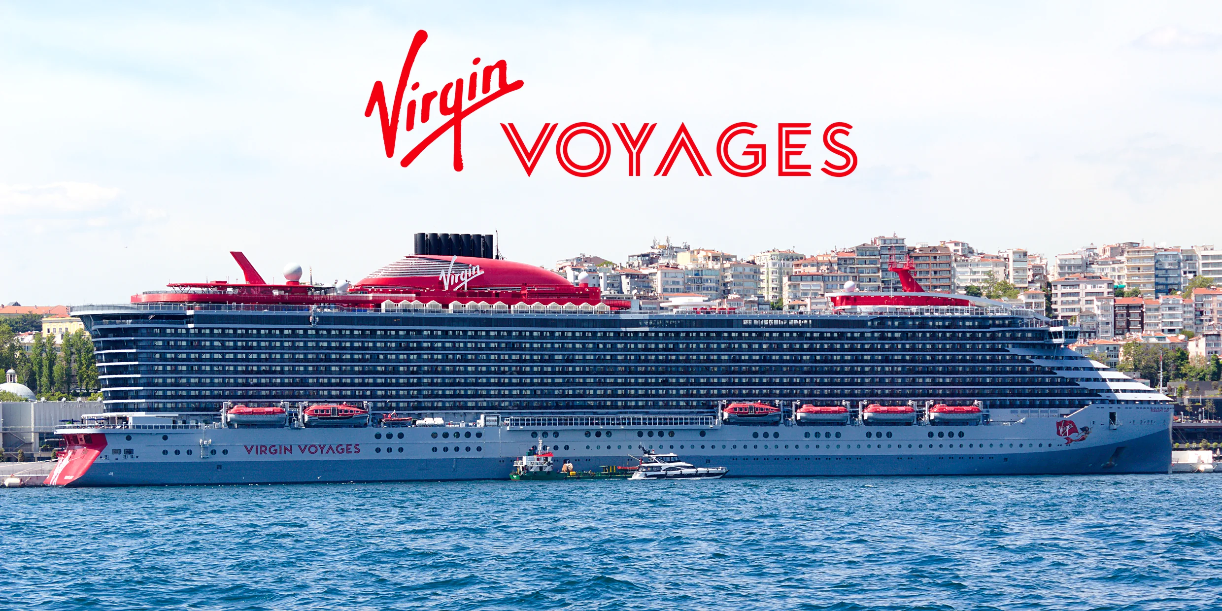 Virgin Voyages’ Resilient Lady on deep blue water under the red Virgin Voyages logo