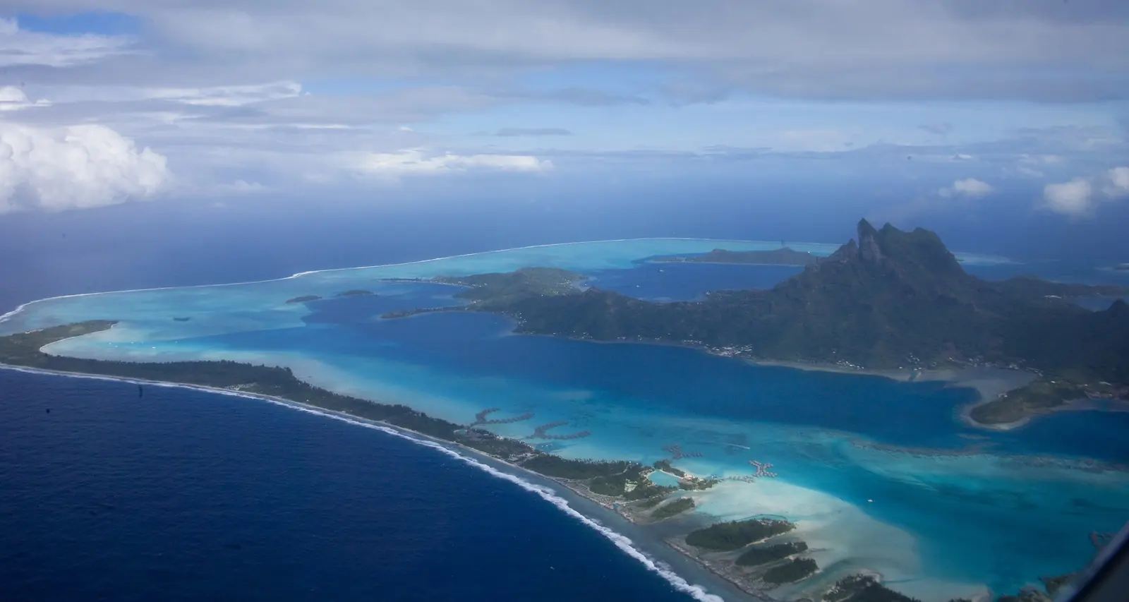 Aerial view of Bora Bora’s turquoise lagoon and Mount Otemanu, French Polynesia