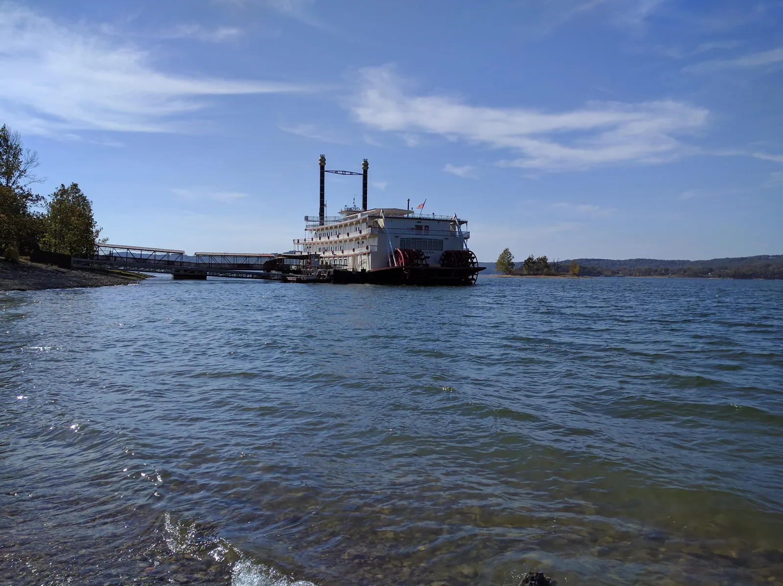 The Showboat Branson Belle paddlewheeler on blue Table Rock Lake under a sunny sky near Branson, Missouri