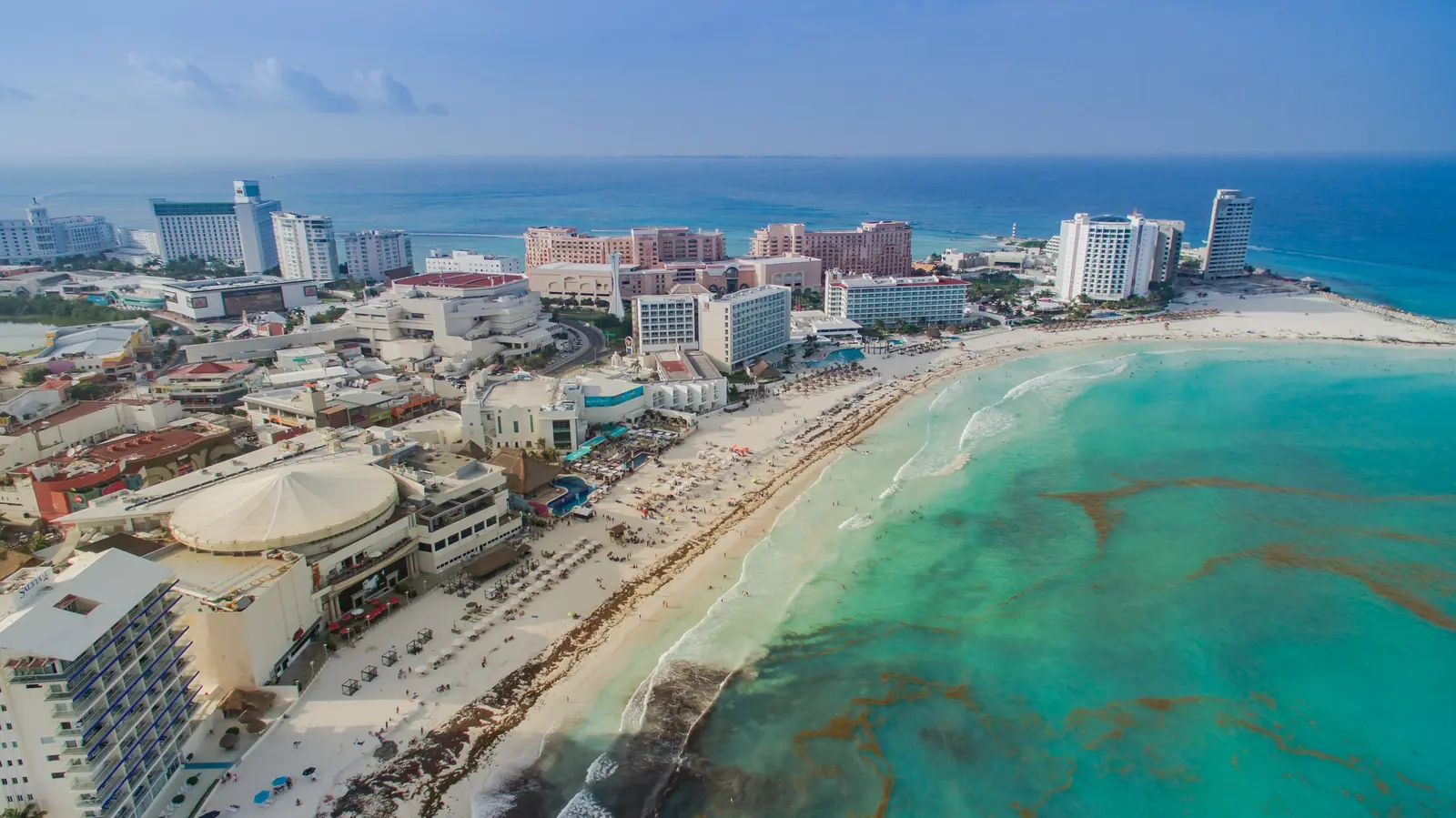 Aerial view of Cancun’s hotel zone beach and turquoise Caribbean water
