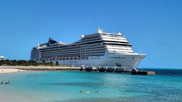 MSC Magnifica beside the turquoise water and beach at Ocean Cay MSC Marine Reserve