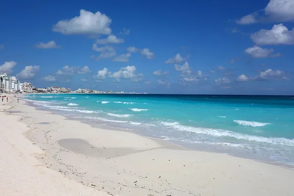 Wide white-sand beach in Cancun, Mexico