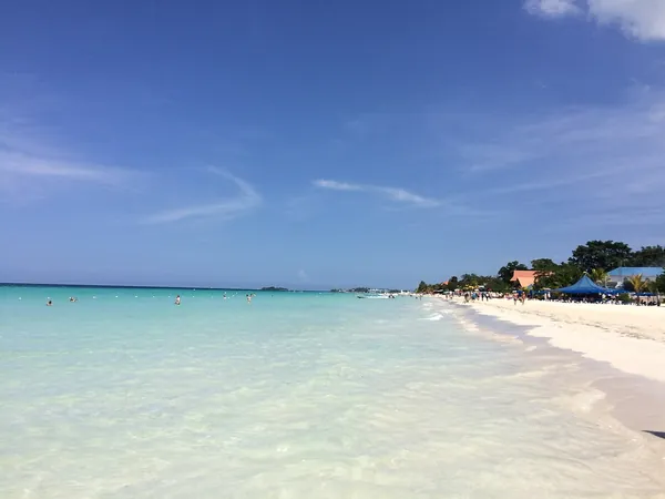 White sand and clear water on the beach in Negril, Jamaica