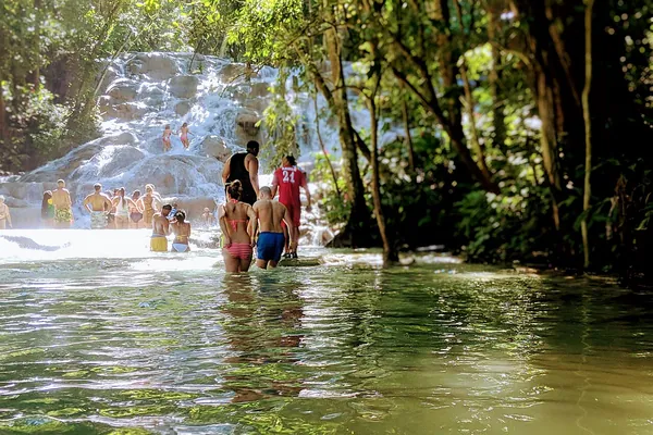Visitors climbing Dunn’s River Falls, Jamaica