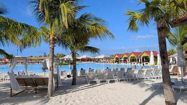 Palms, loungers and turquoise water at Celebration Key, Grand Bahama