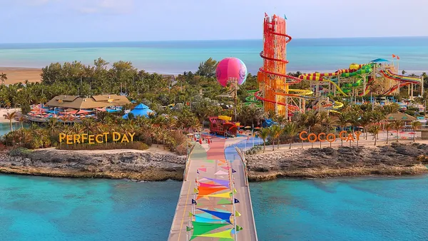 Colorful walkway, pools and the Up, Up and Away balloon at Perfect Day at CocoCay