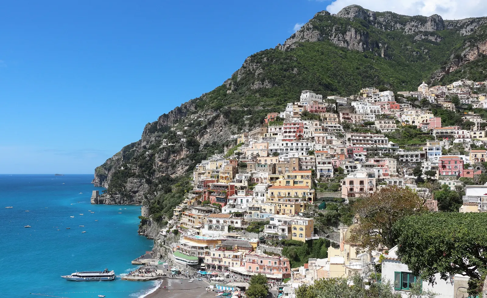 Colorful houses of Positano stacked on the cliffs above the sea, Amalfi Coast, Italy